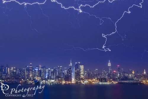 "Strikes and Bolts"  The New York City Skyline is lit up by lightning during a summer thunderstorm.